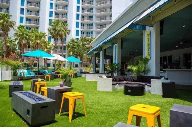 a view of an house with backyard and patio