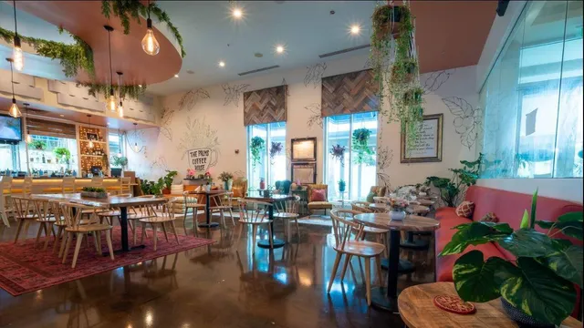 a living room with lots of furniture and flowers