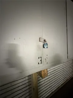 a view of parking garage with cars