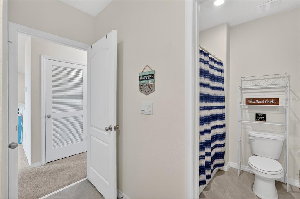 1809 Myrtlebrooke Drive Edgewater, FL 32141 - Photo 31 of 58 a bathroom with a toilet and a shower