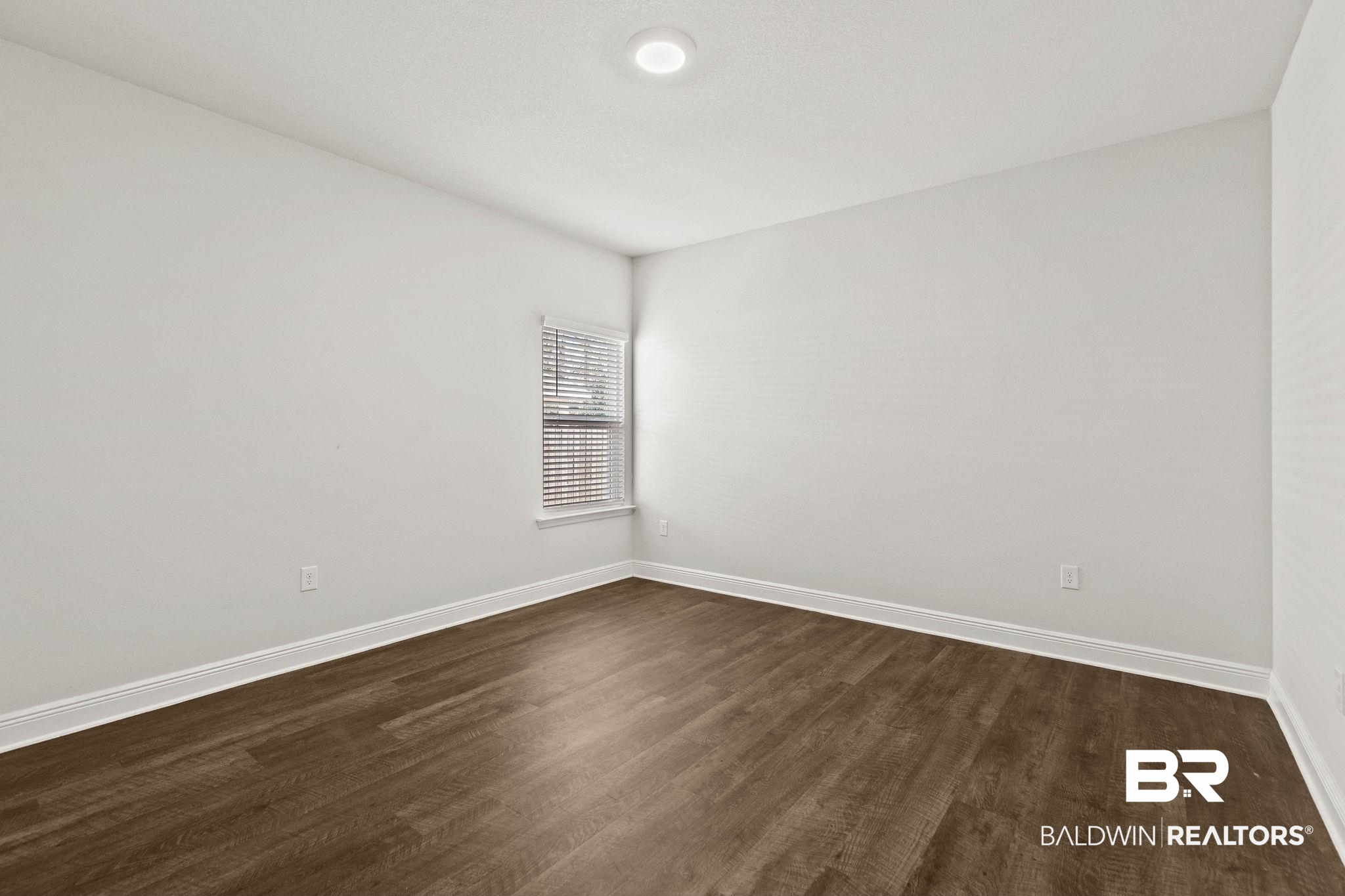 9448 Amethyst Drive Daphne, AL 36526 - Photo 42 of 61 Empty room with dark wood-style floors