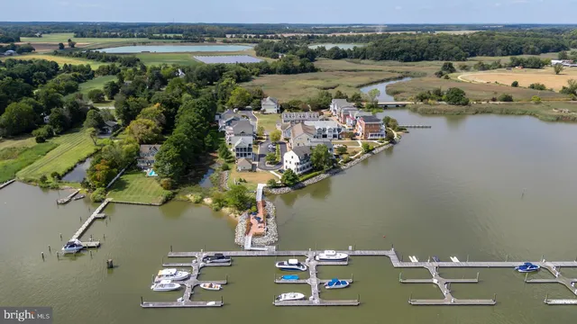 an aerial view of a house with a lake view