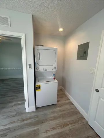 a view of hallway with wooden floor