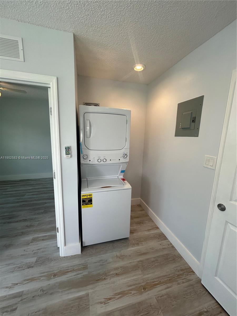 250 Southwest Airview Avenue, Unit B Port St. Lucie, FL 34984 - Photo 4 of 5 a view of hallway with wooden floor