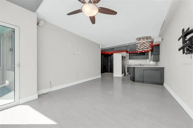 a view of kitchen with refrigerator and microwave