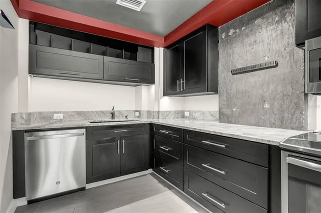 a spacious bathroom with a granite countertop sink a toilet and mirror