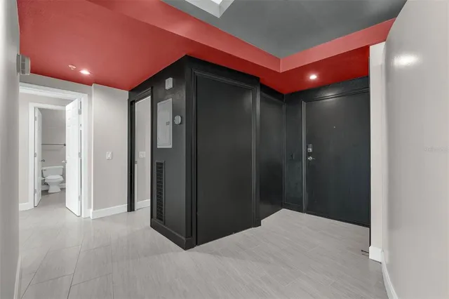 a view of washer and dryer with bathroom in the background