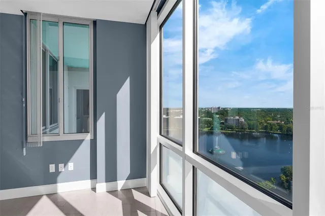 an empty room with a ceiling fan and a fan