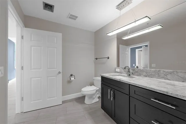 a view of a bathroom from a hallway