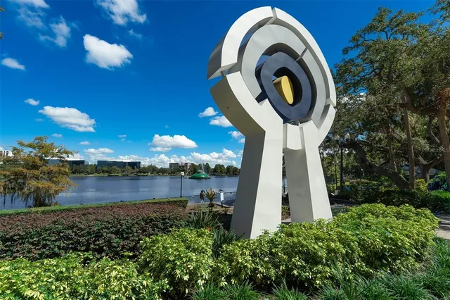 a view of a garden with large trees