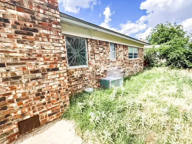 a view of a back yard from a balcony