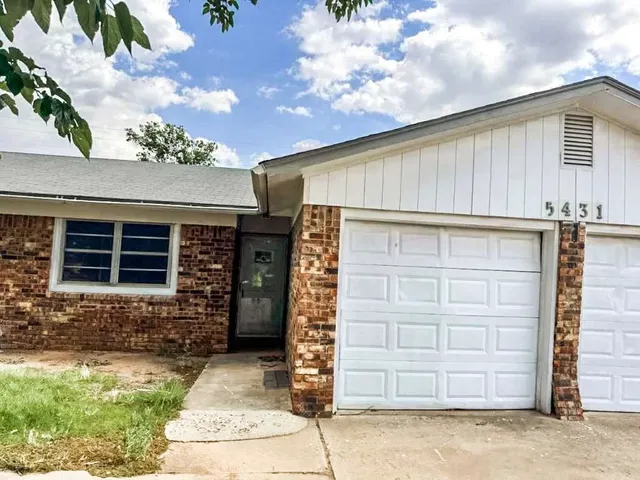 a front view of a house with a garage