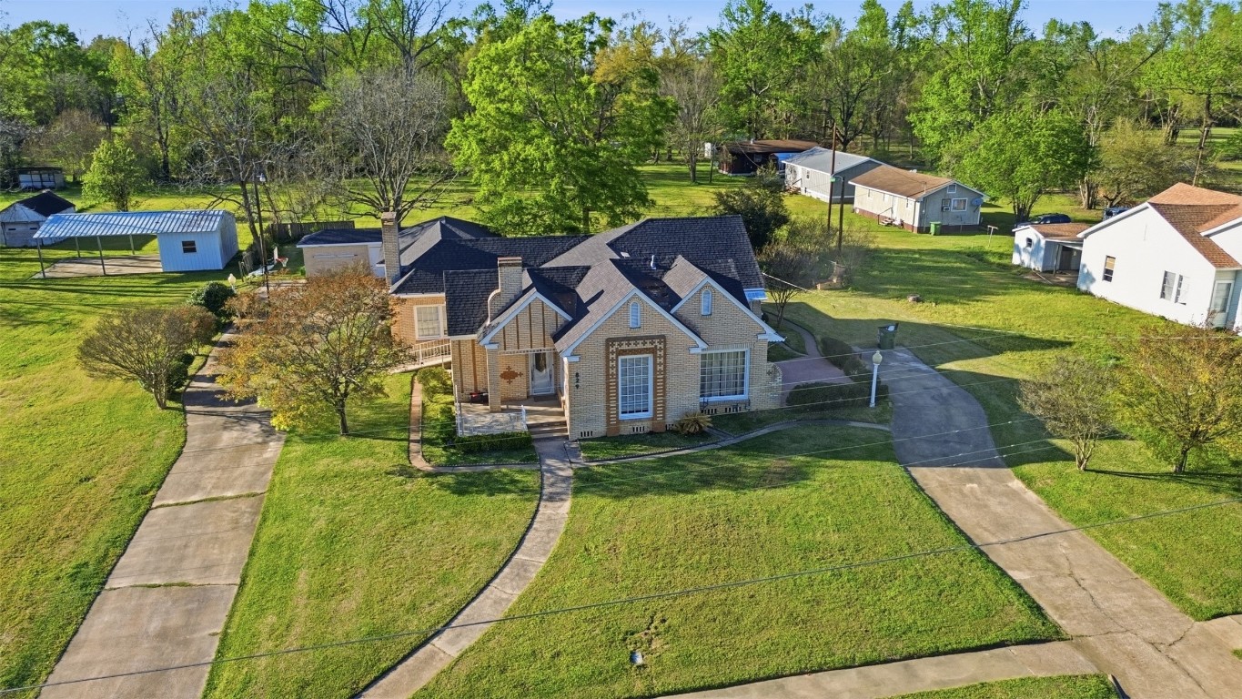 829 Bear Drive Timpson, TX 75975 - Photo 1 of 47 a view of a house with a yard patio and fire pit