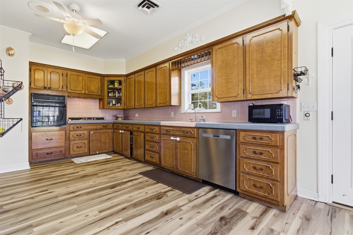 829 Bear Drive Timpson, TX 75975 - Photo 12 of 47 a kitchen with stainless steel appliances granite countertop a stove a sink and a microwave