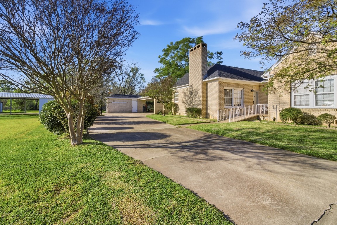 829 Bear Drive Timpson, TX 75975 - Photo 3 of 47 a front view of a house with garden