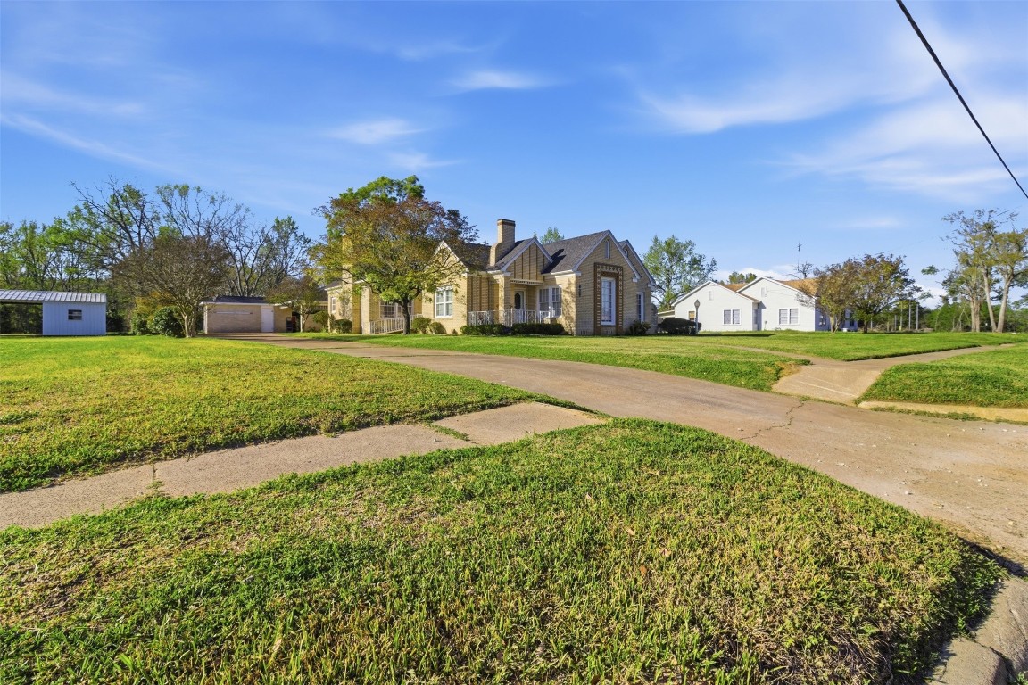 829 Bear Drive Timpson, TX 75975 - Photo 31 of 47 a view of a big yard with palm trees