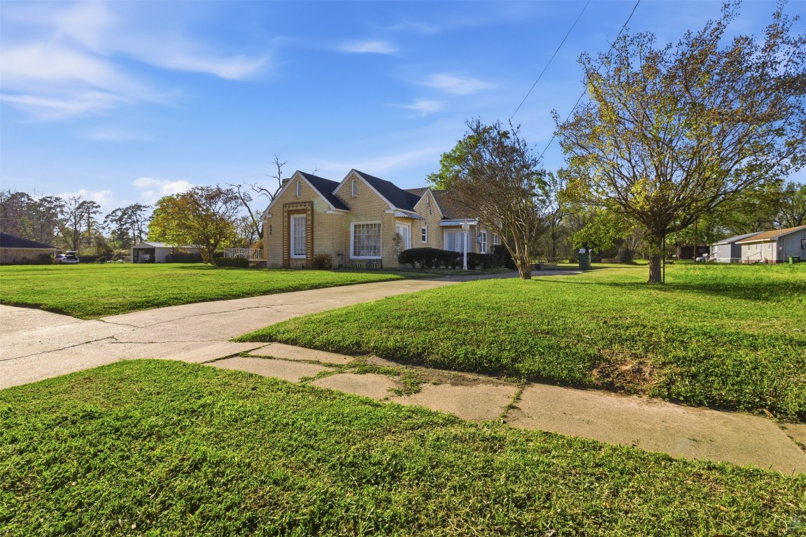 829 Bear Drive Timpson, TX 75975 - Photo 33 of 47 a front view of a house with a yard and garage