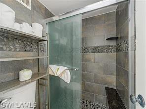 2555 9th Street North, Unit 109 Naples, FL 34103 - Photo 4 of 6 a bathroom with a shower