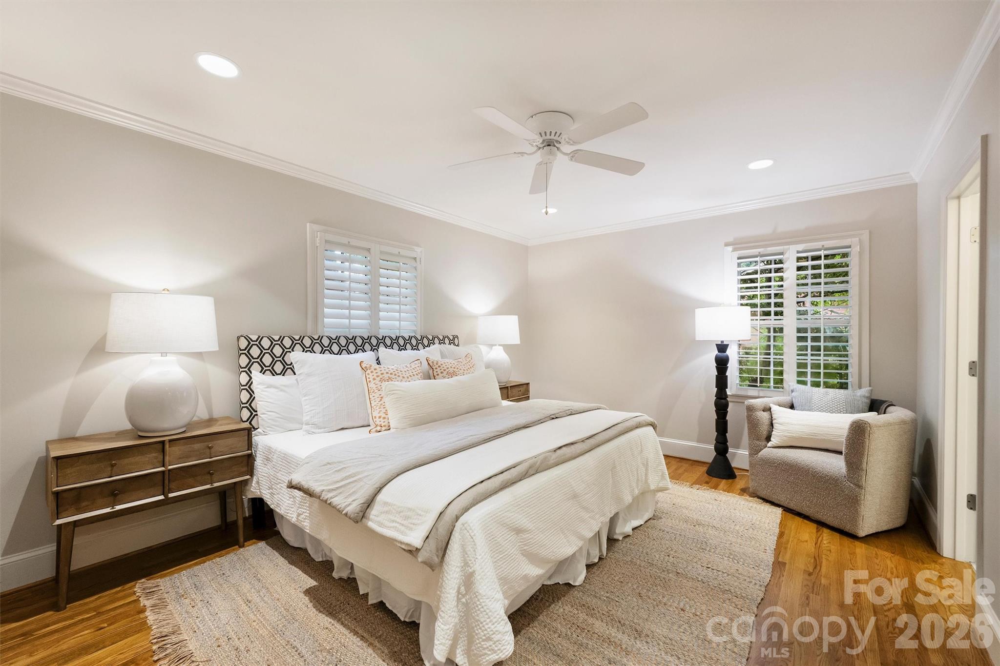 5519 Robinhood Road Charlotte, NC 28211 - Photo 30 of 46 a bedroom with a bed and wooden floor