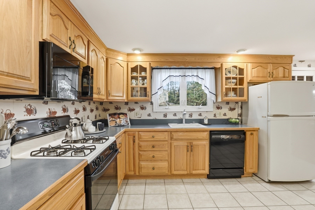 2 Glenwood Road Andover, MA 01810 - Photo 13 of 42 a kitchen with a sink a stove top oven and white stainless steel appliances