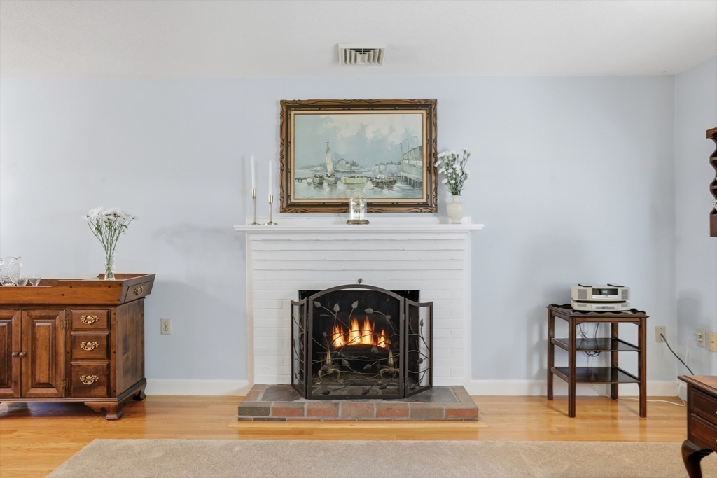 2 Glenwood Road Andover, MA 01810 - Photo 17 of 42 a living room with furniture and a fireplace