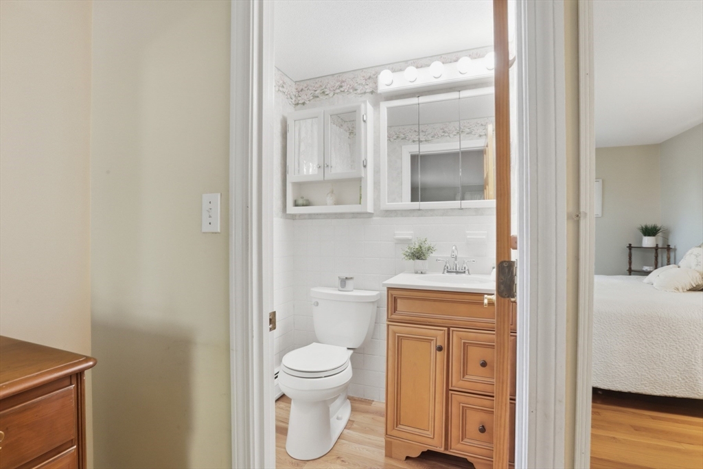 2 Glenwood Road Andover, MA 01810 - Photo 21 of 42 a bathroom with a toilet a sink and shower