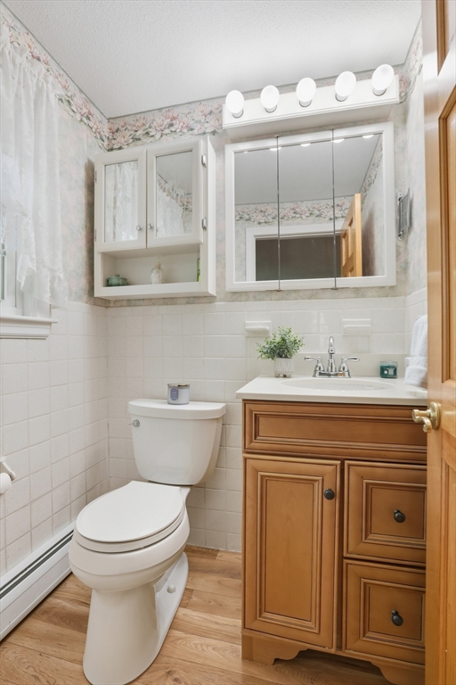 2 Glenwood Road Andover, MA 01810 - Photo 22 of 42 a bathroom with a granite countertop toilet sink and mirror