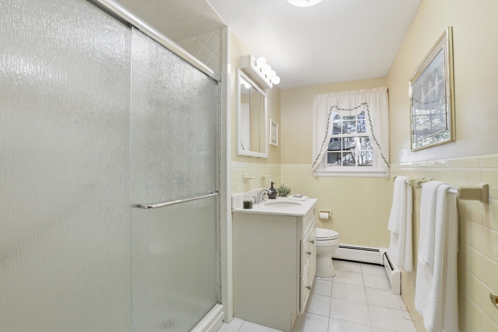 2 Glenwood Road Andover, MA 01810 - Photo 26 of 42 a bathroom with a bathtub a toilet and a shower