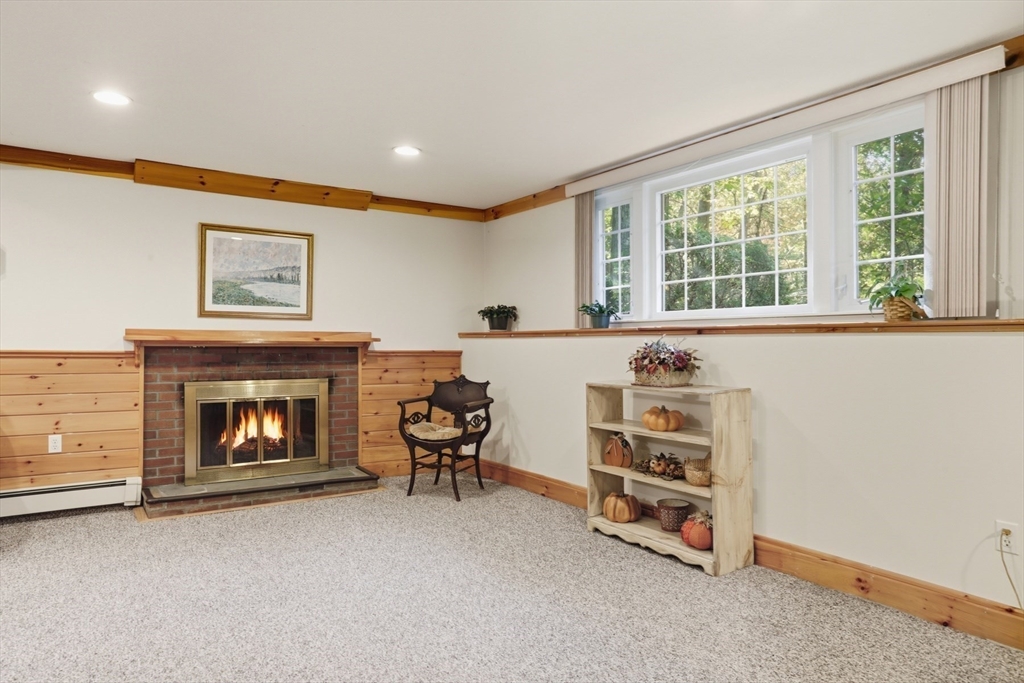 2 Glenwood Road Andover, MA 01810 - Photo 28 of 42 a living room with furniture and a fireplace