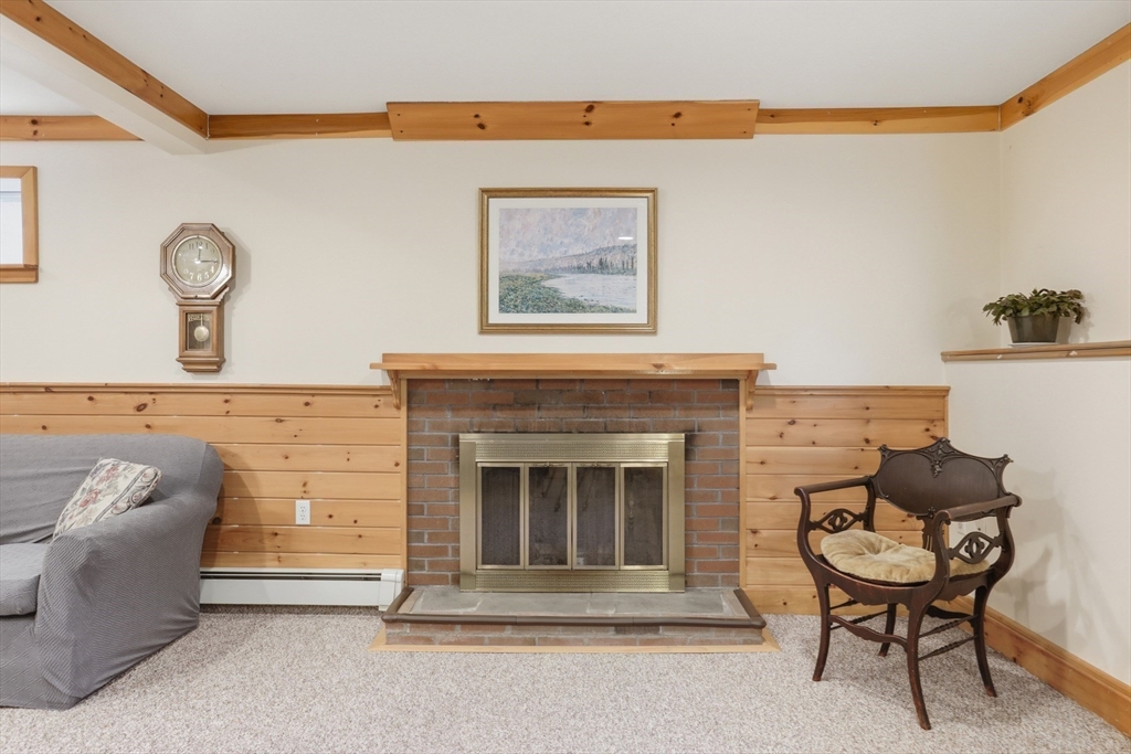 2 Glenwood Road Andover, MA 01810 - Photo 29 of 42 a living room with furniture and a fireplace