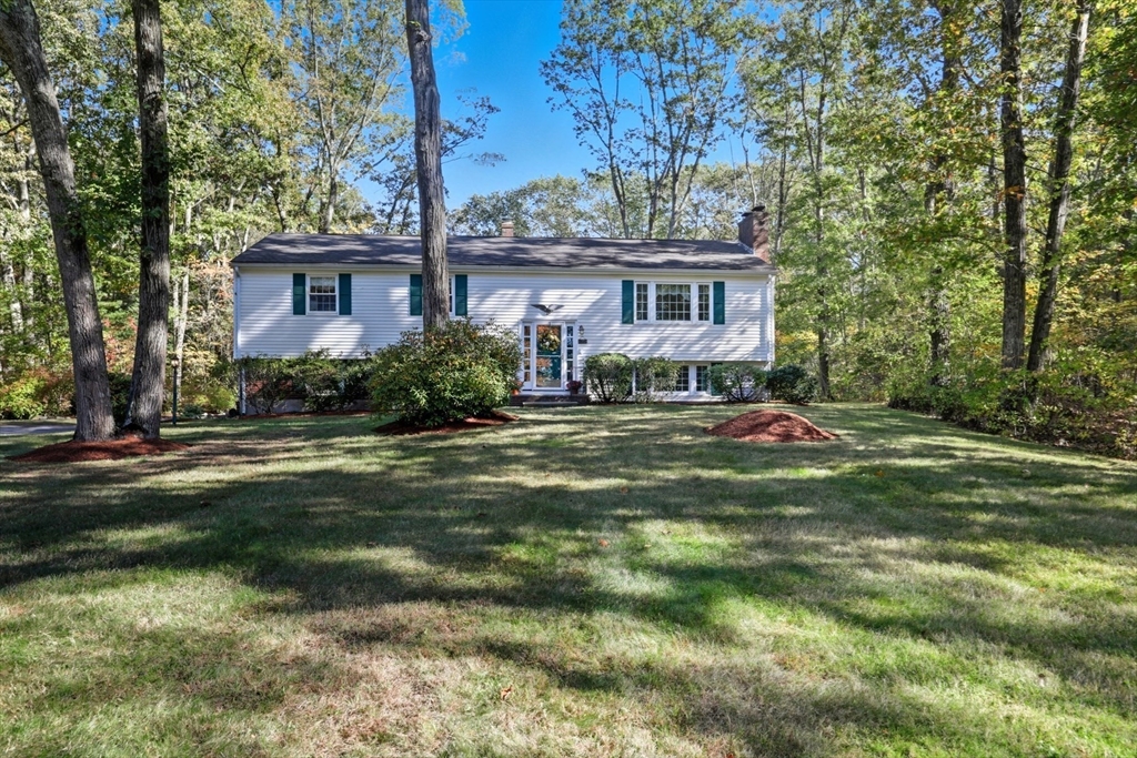 2 Glenwood Road Andover, MA 01810 - Photo 3 of 42 a front view of a house with a garden