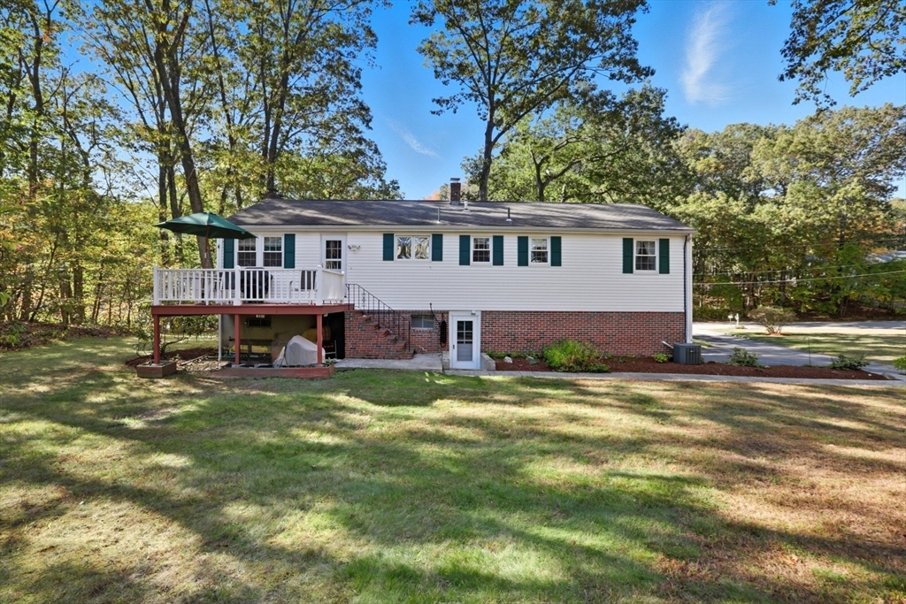 2 Glenwood Road Andover, MA 01810 - Photo 4 of 42 a view of a house with a patio and a yard