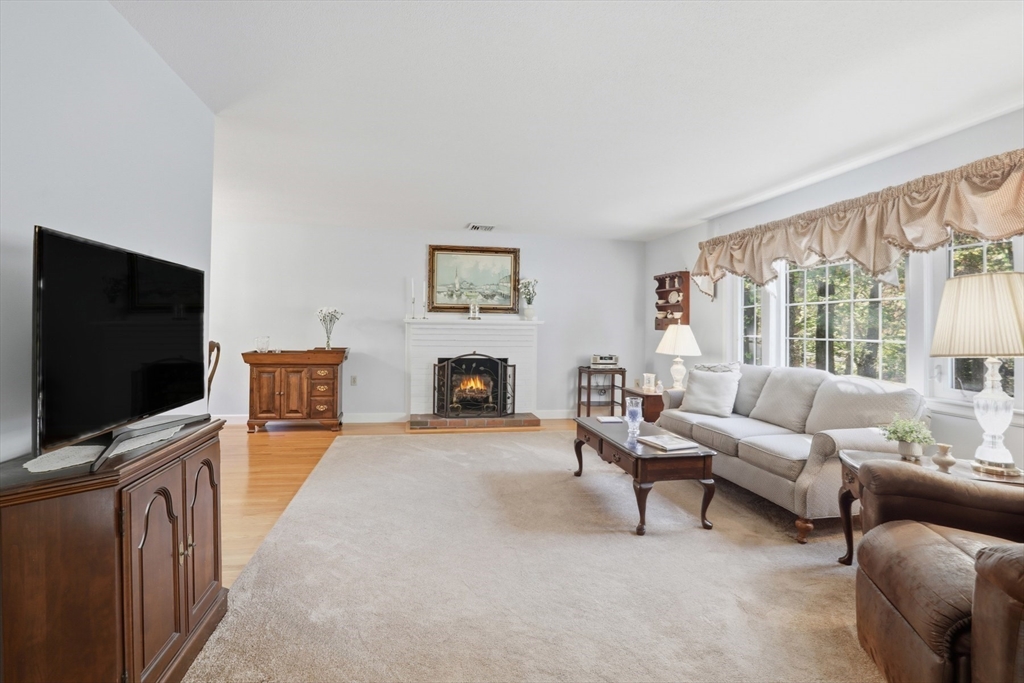 2 Glenwood Road Andover, MA 01810 - Photo 6 of 42 a living room with furniture and a flat screen tv