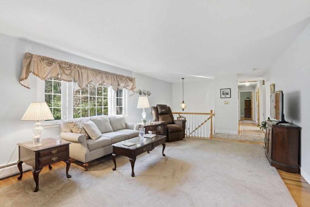 2 Glenwood Road Andover, MA 01810 - Photo 7 of 42 a living room with furniture and a flat screen tv