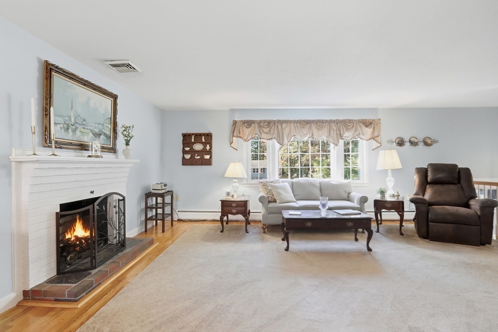 2 Glenwood Road Andover, MA 01810 - Photo 8 of 42 a living room with furniture and a fireplace