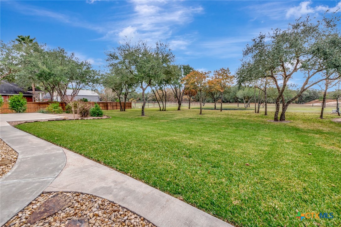 249 Post Oak Bend Inez, TX 77968 - Photo 28 of 36 a big yard with lots of green space and palm trees