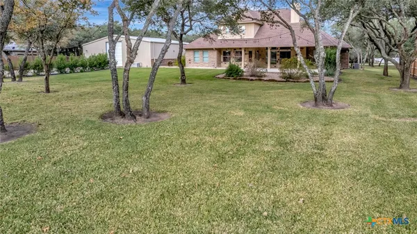 a view of yard with swimming pool
