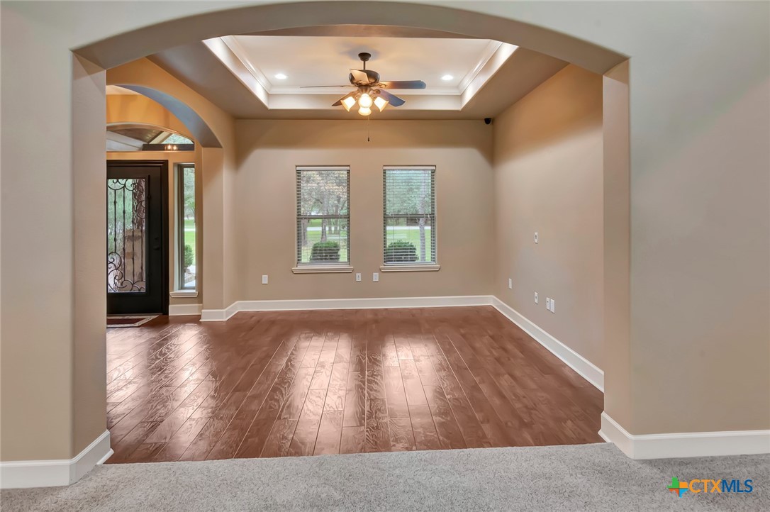 249 Post Oak Bend Inez, TX 77968 - Photo 4 of 36 wooden floor in an empty room with a window