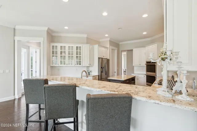 a front view of a building with a garden