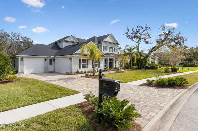 a view of entryway with wooden floor and stairs