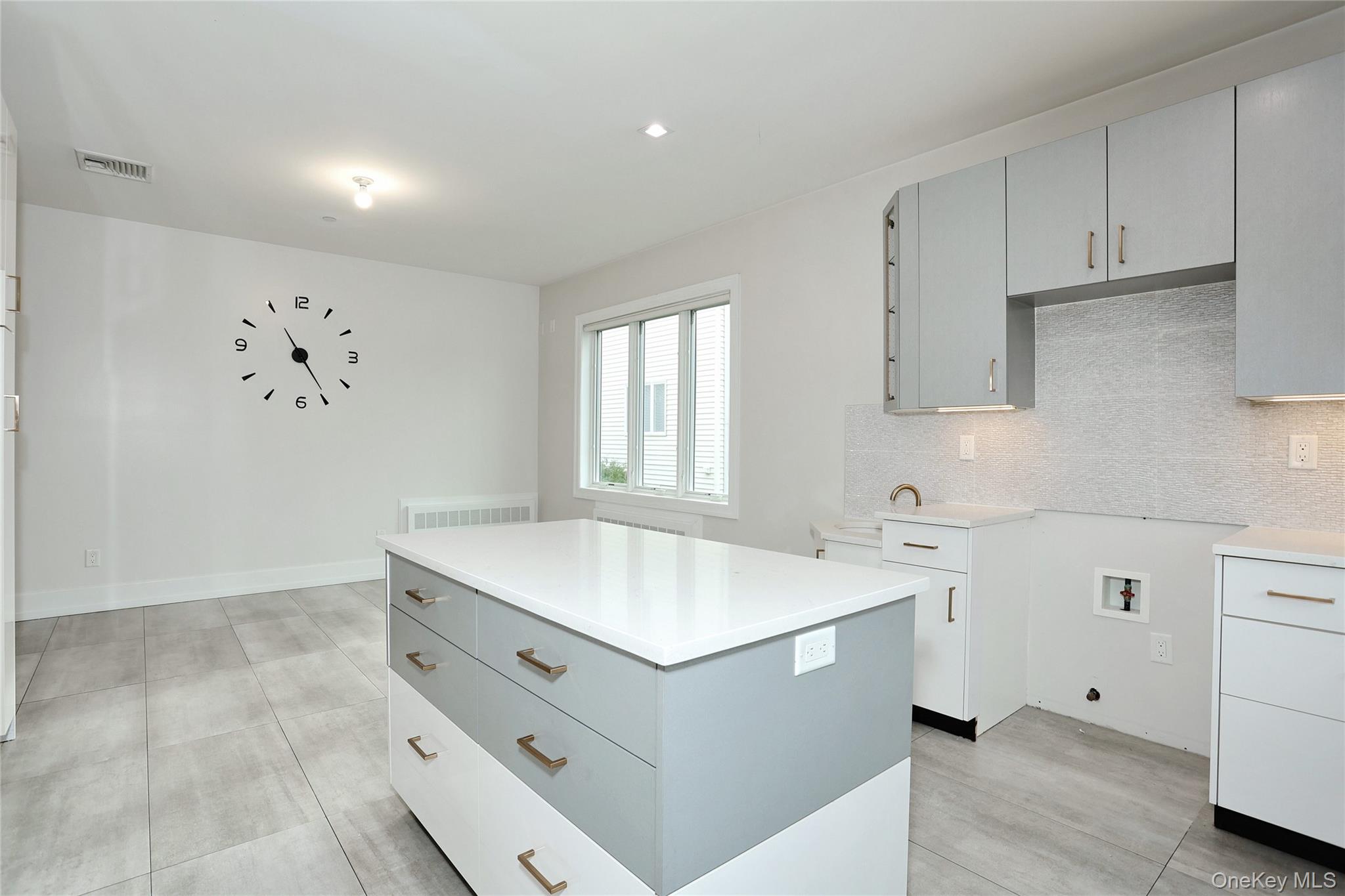 8 Neil Road, Unit 213 Spring Valley, NY 10977 - Photo 15 of 50 a utility room with cabinets washer and dryer