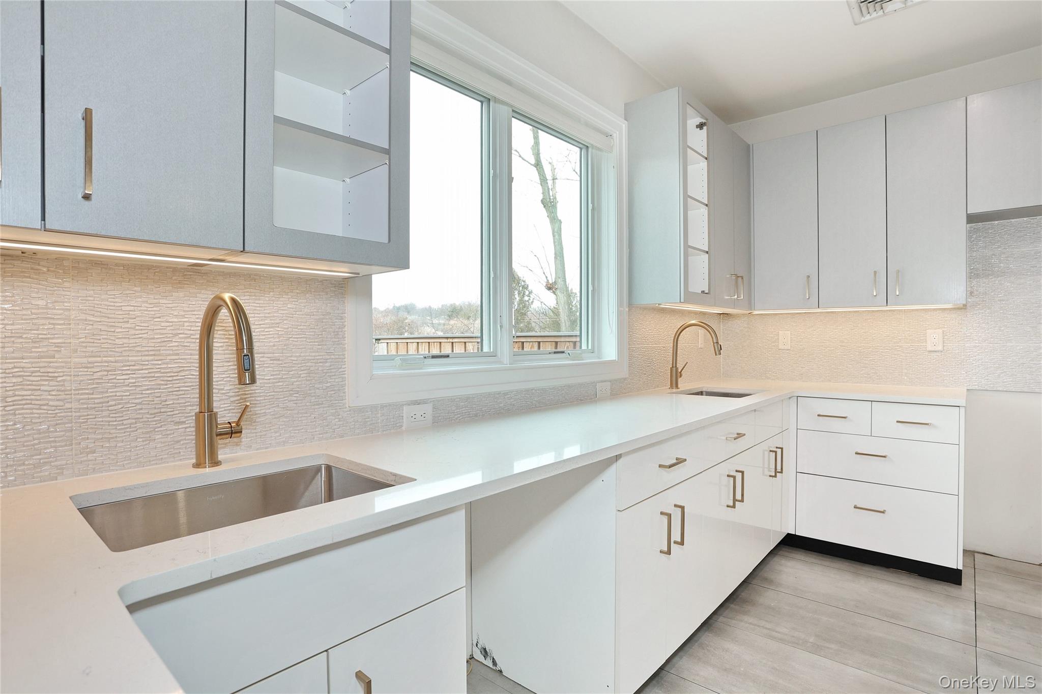 8 Neil Road, Unit 213 Spring Valley, NY 10977 - Photo 17 of 50 a kitchen with white cabinets and a sink