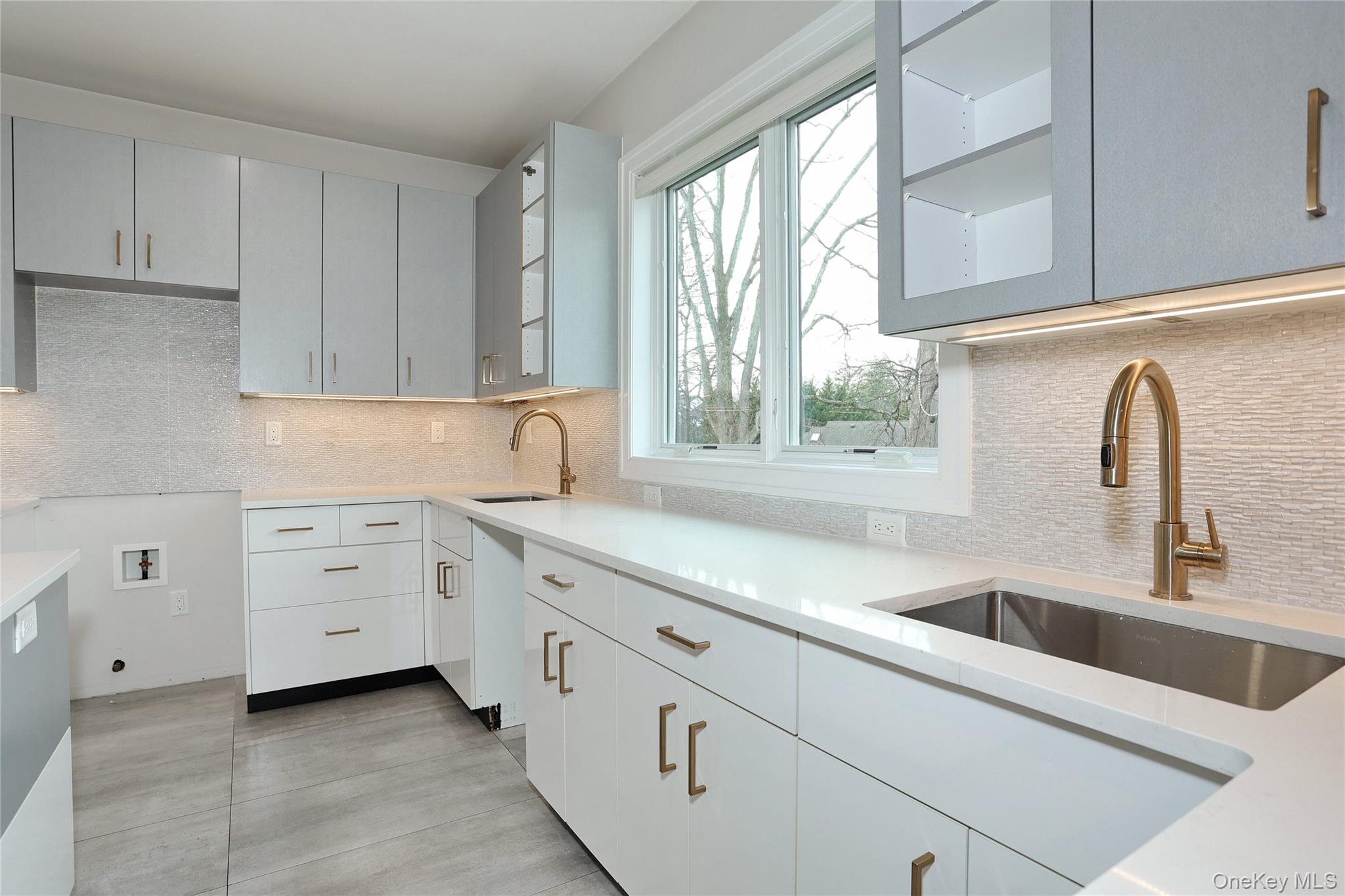 8 Neil Road, Unit 213 Spring Valley, NY 10977 - Photo 18 of 50 a kitchen with cabinets appliances a sink and a window
