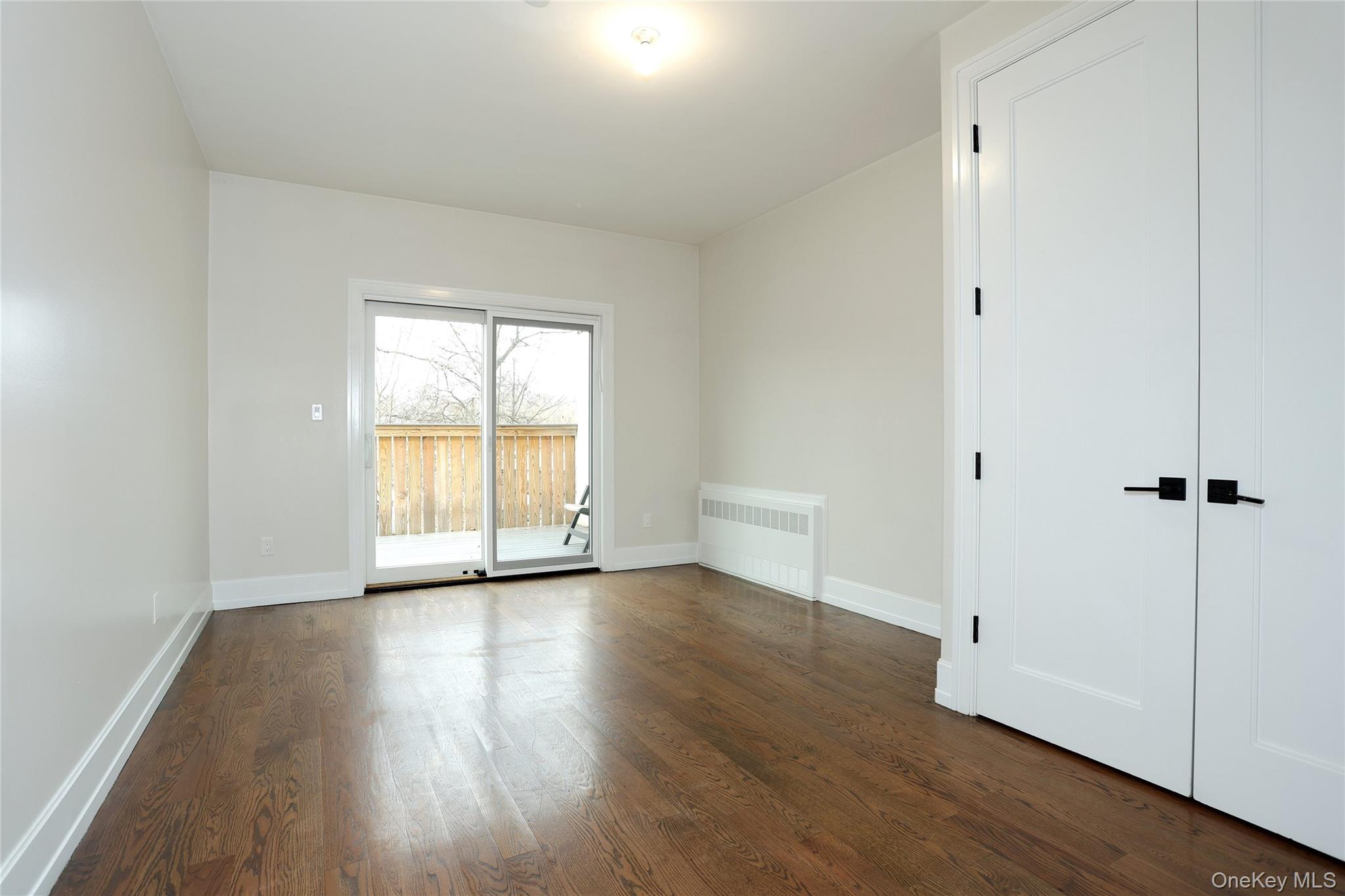 8 Neil Road, Unit 213 Spring Valley, NY 10977 - Photo 19 of 50 a view of a room with wooden floor and window