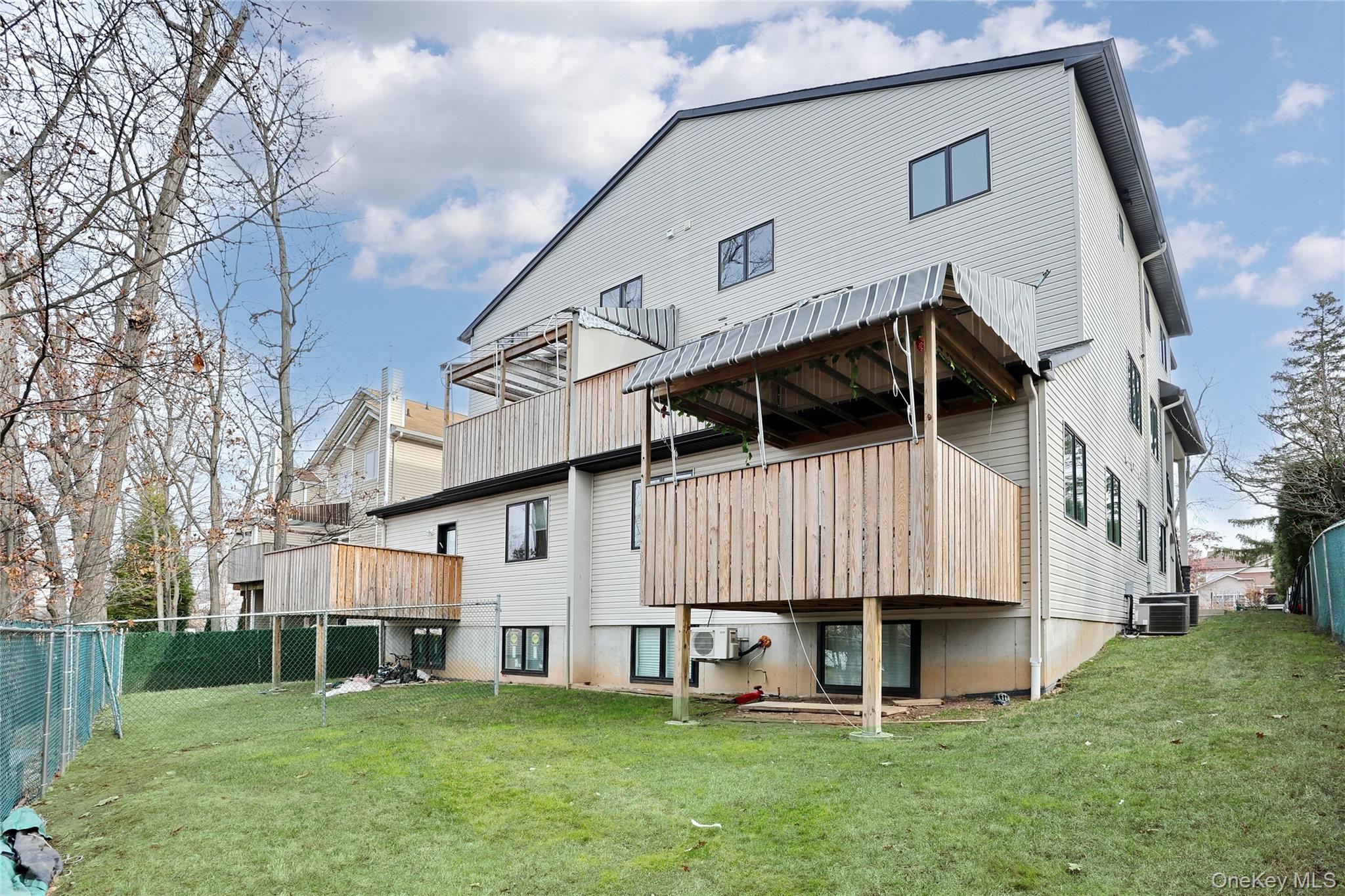 8 Neil Road, Unit 213 Spring Valley, NY 10977 - Photo 2 of 50 a view of a white house with a yard