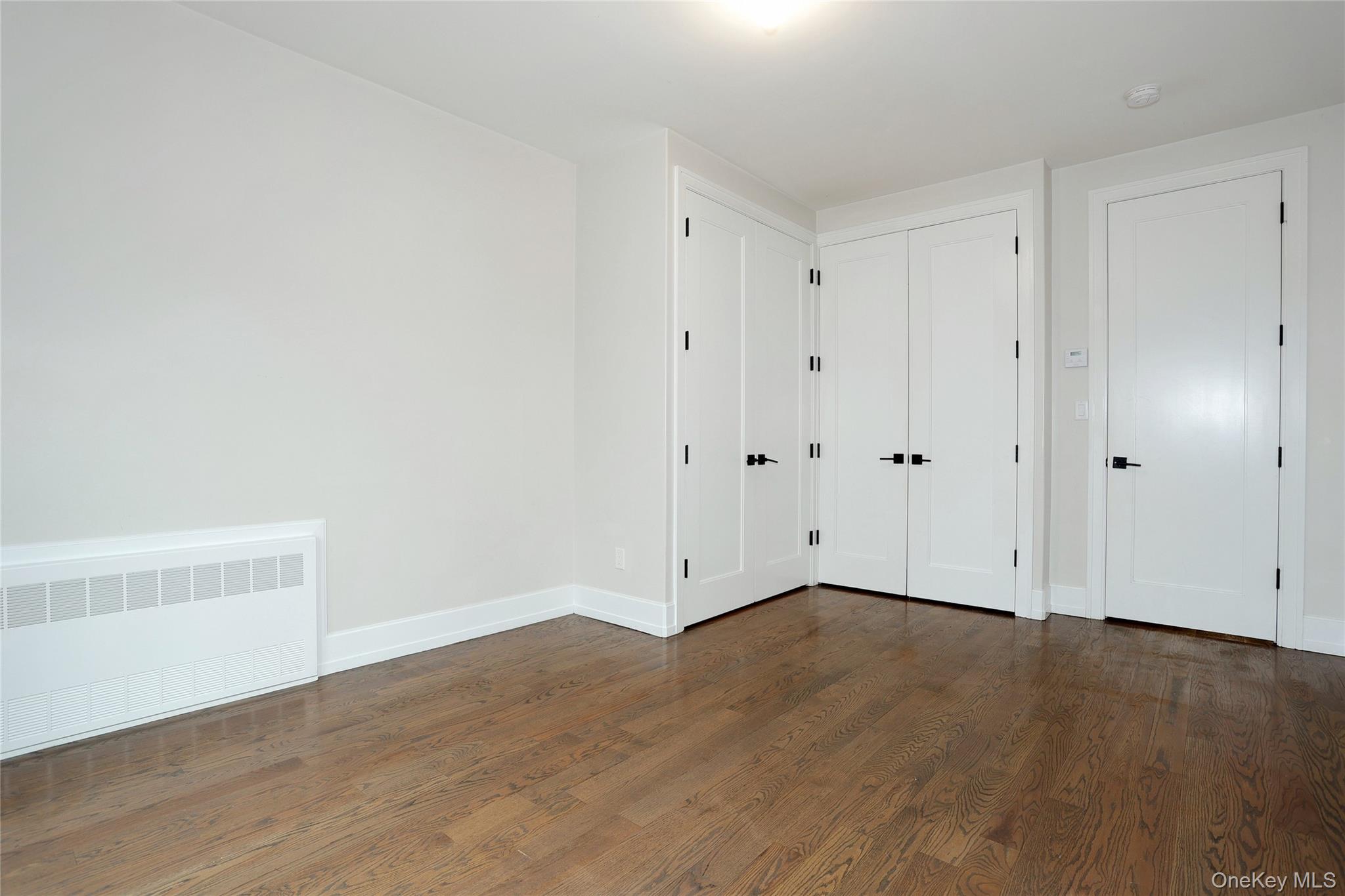 8 Neil Road, Unit 213 Spring Valley, NY 10977 - Photo 21 of 50 a view of an empty room with wooden floor