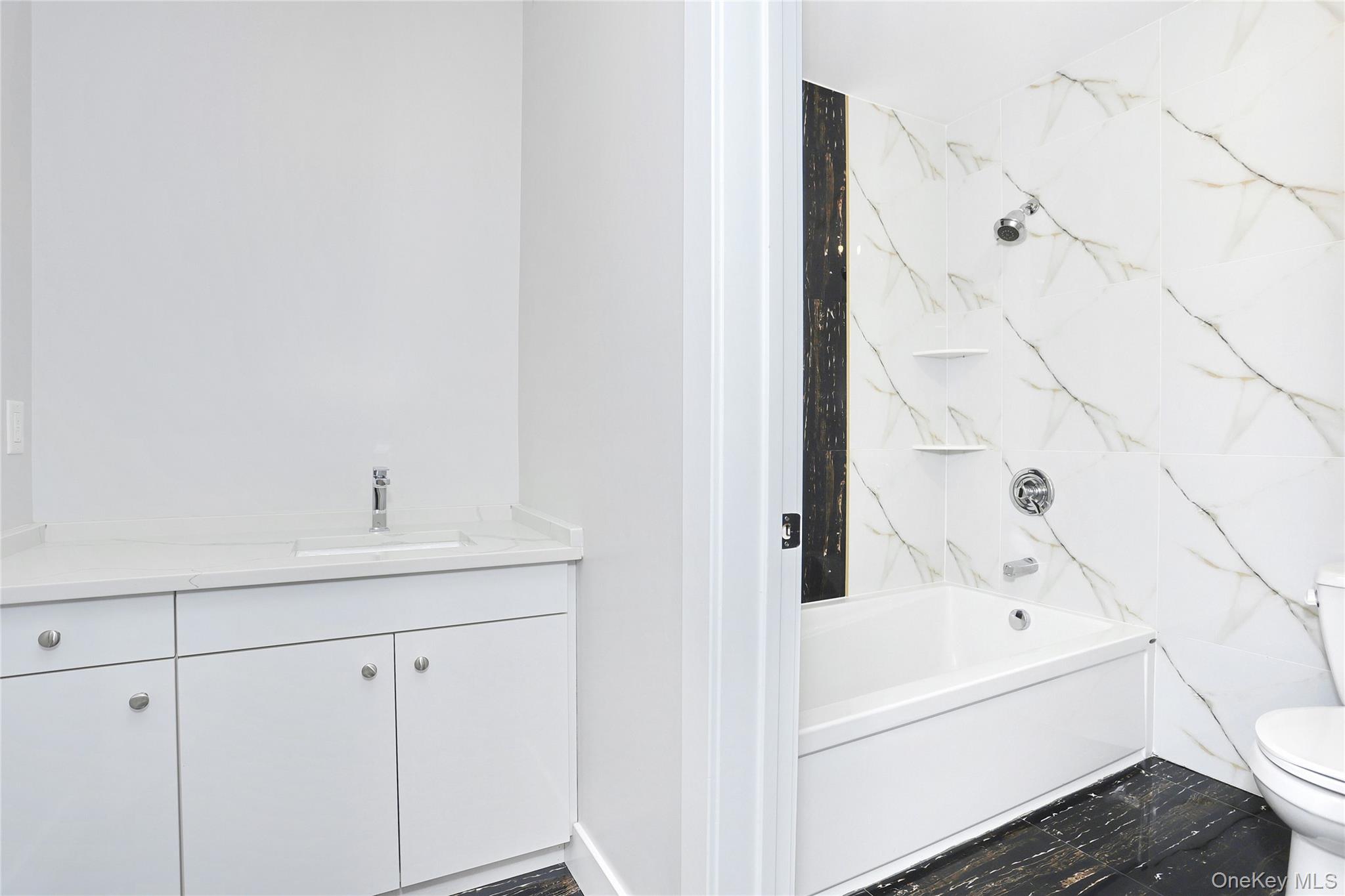 8 Neil Road, Unit 213 Spring Valley, NY 10977 - Photo 28 of 50 a bathroom with a bathtub and sink