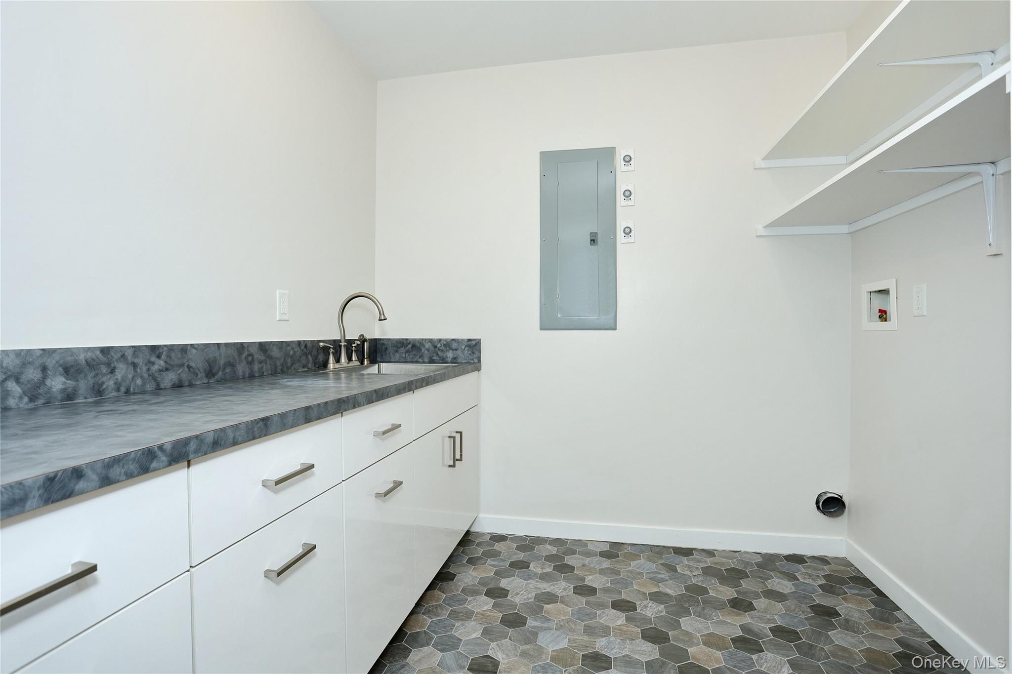 8 Neil Road, Unit 213 Spring Valley, NY 10977 - Photo 30 of 50 a bathroom with a granite countertop sink and a mirror