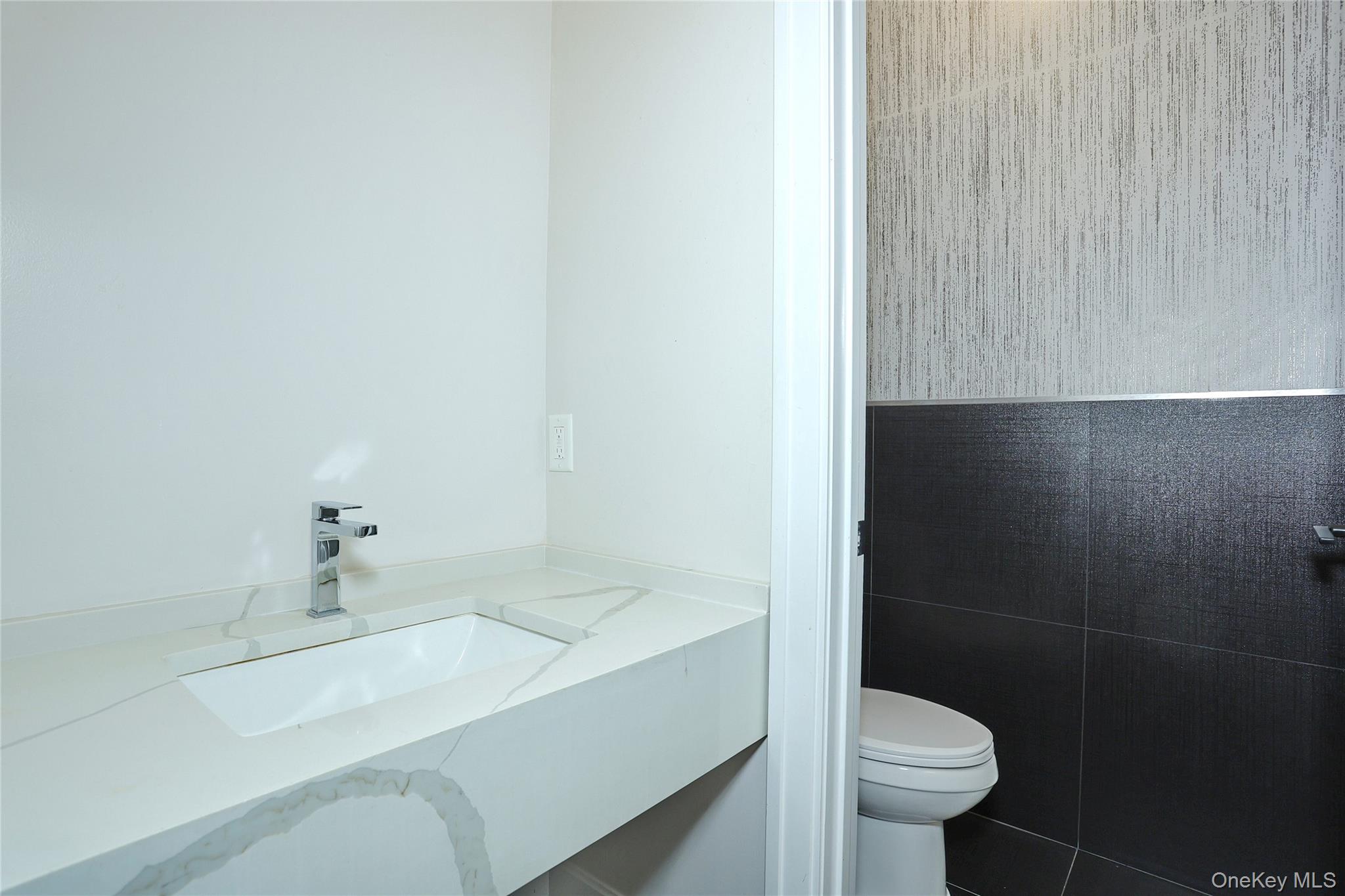 8 Neil Road, Unit 213 Spring Valley, NY 10977 - Photo 8 of 50 a bathroom with a sink and a toilet