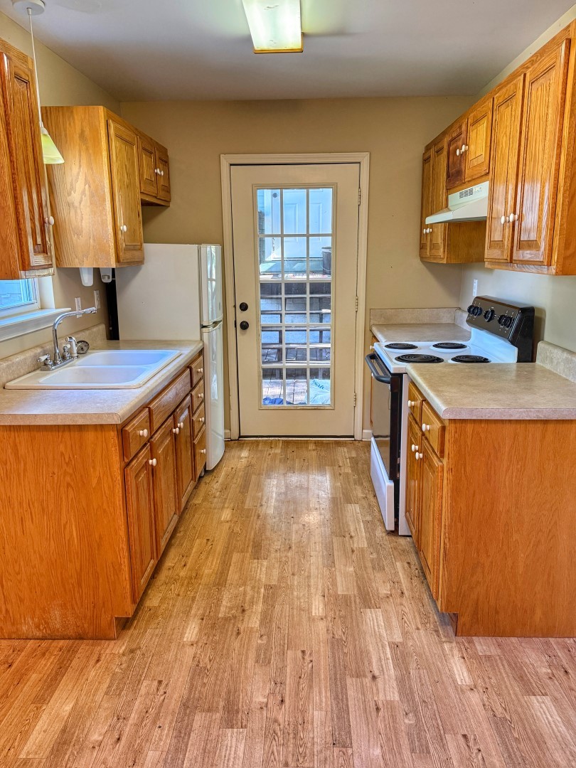 1381 Turkey Creek Road Dickson, TN 37055 - Photo 21 of 35 a kitchen with a sink wooden floor and a large window